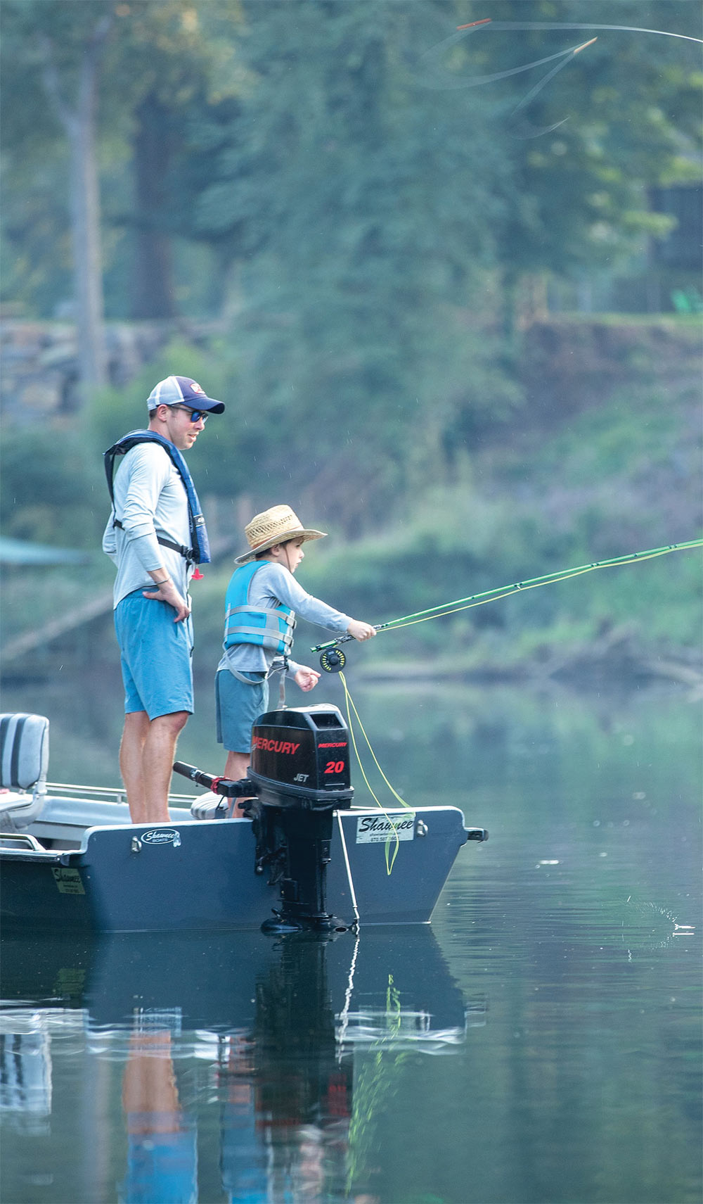 A boy and his father fishing